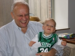 Leslie Gelb, in a photo taken in 2006, is seen laughing with Patrick, one of his five grandsons. (Photo courtesy of Leslie Gelb family)
