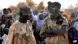 Chadian soldiers are pictured in a refugee camp near the township of Goz Beida, at the Chadian-Sudanese border, 15 Mar 2009