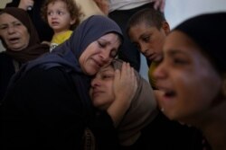 Relatives mourn the death of Iyad al-Rabiel, a 14-year-old Palestinian who was shot and killed by Israeli troops during Friday's protest along the Gaza Strip's border with Israel, in the family home in Gaza City, Sept. 7, 2019.