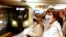 Passengers with face masks wait for a train at the Alexanderplatz underground station in Berlin, Germany, where like many other countries, it is mandatory to wear a cover for mouth and nose at public transport.