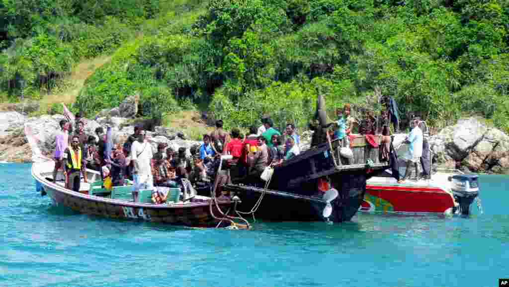 A boat carrying 73 Rohingya refugees is intercepted by Thai authorities off the sea in Phuket, southern Thailand, January 1, 2013.