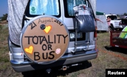 A minibus parked in a designated eclipse viewing area is seen in a campground near Guernsey, Wyoming, Aug. 20, 2017.