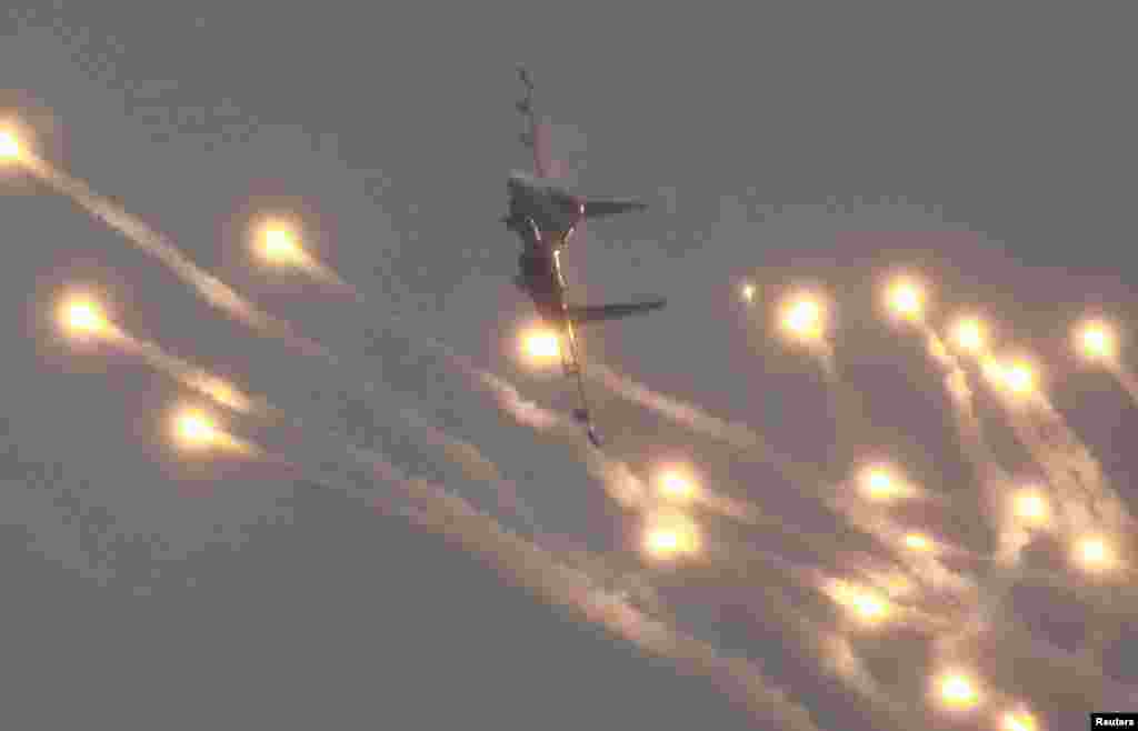 A Sukhoi Su-27 jet fighter of the Russkiye Vityazi (Russian Knights) aerobatic team performs during a demonstration flight at the MAKS International Aviation and Space Salon in Zhukovsky, outside Moscow. 
