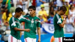 File - Alan Pulido (center) in the 2014 World Cup.
