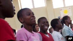 FILE - An aisle of girls at Camp GLOW (Girls Leading Our World) run by the Peace Corps, in Lilongwe, Malawi.