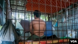 Ly's hut is made out of zinc and is equipped with a small bed, a mosquito net, a toilet and a water tank for showers, Prey Veng province, Cambodia, February 24, 2017. (Khan Sokummno/VOA Khmer)