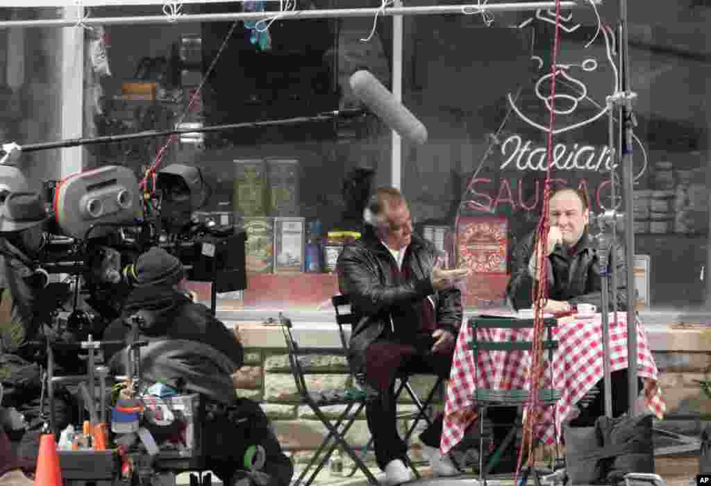 Actors Tony Sirico, who plays Paulie Walnuts and James Gandolfini, who plays Tony Soprano, shoot a scene from the mafia drama, "The Sopranos," outside the fictional Satriale's pork store in Kearny, New Jersey, March 21, 2007.