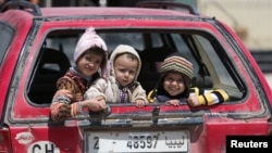 Children sit in a car in Benghazi, Libya, April 22, 2017. UNICEF says nearly 200,000 children in Libya need clean water, and more than 300,000 need educational support.