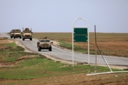 FILE - U.S. troops patrol near the Turkish border in Hasakah, Syria, Nov. 4, 2018.