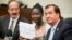 Deborah Peter, center, sole survivor of a Boko Haram attack on her family, House Foreign Affairs Committee Chairman Rep. Ed Royce, right, and Rep. Eliot Engel meet before a House hearing on the terror group in Washington, May 21, 2014.