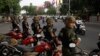 FILE: Riot police block a street near the Supreme Court in Phnom Penh, Cambodia, Tuesday, Oct. 31, 2017. The Supreme Court on Tuesday uphold the lower court's decision to continue to detain opposition leader Kem Sokha who has been charged with treason, the latest in a series of moves to gain an advantage ahead of 2018 general election. (AP Photo/Heng Sinith)