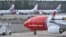 FILE - Boeing 737-800 aircraft belonging to budget carrier Norwegian are parked at Stockholm Arlanda Airport, March 5, 2015.