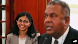 Sri Lanka’s Foreign Minister Mangala Samaraweera, right, speaks as U.S. Assistant Secretary of State for South and Central Asian Affairs Nisha Biswal smiles during a media briefing in Colombo, Sri Lanka, Monday, Feb. 2, 2015.