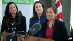 Interior Secretary Deb Haaland responds to a question as Becky Mitchell, left, of the Colorado Water Conservation Board, and U.S. Rep Diana DeGette, D-Colo., look on during a news conference, in Denver, July 22, 2021.