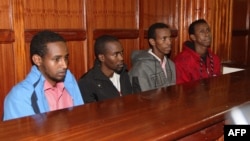 FILE - This picture taken on Nov. 14, 2013 shows (from L) four men charged in connection with the Westgate mall massacre, Mohamed Abdi Ahmed, Omar Liban Abdulle, Adan Mohamed Ibrahim, and Hussein Hassan Mustafa sitting at court in Nairobi. 