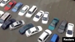 A still image taken from video shows submersed cars in floods water after Hurricane Maria battered Caguas, Puerto Rico, Sept. 20, 2017. 