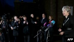 British Prime Minister Theresa May speaks to the media outside Stormont House in Belfast on February 12, 2018 after meetings with representatives of the Northern Ireland political parties. 