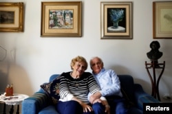 Aviva Ephrati, left, 84, retired kindergarten teacher, and Israel Ephrati, 87, retired supervisor at a higher educational institution, sit in the living room at the protective housing in Kfar Saba, north of Tel Aviv, Israel, Feb. 8, 2018.