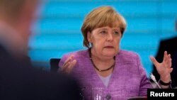 FILE - German Chancellor Angela Merkel in Berlin, July 3, 2013. 