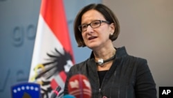 FILE - Austrian Interior Minister Johanna Mikl-Leitner speaks at a press conference, Feb. 20, 2015.