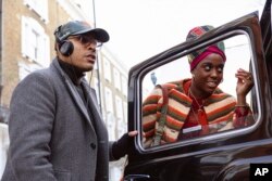 FILE—Director Reinaldo Marcus Green and actress Lashana Lynch on the set of "Bob Marley: One Love."