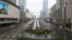 Street view after Wuhan government announced to ban non-essential vehicles in downtown area to contain coronavirus outbreak, on the second day of the Chinese Lunar New Year, in Wuhan, Hubei province, China January 26, 2020. cnsphoto via REUTERS…