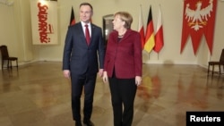 Poland's President Andrzej Duda welcomes German Chancellor Angela Merkel to Warsaw, Poland, Feb. 7, 2017.