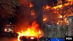 A Los Angeles Fire Department engine arrives at a fire in the Laurel Canyon section of L.A. on Dec.30, 2011. An arsonist torched car after car early Friday, sending firefighters scrambling to put out more than a dozen blazes throughout the city. (AP)