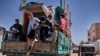 Pilgrims to Humaithera gather and prepare their truck for the trip at the transportation hub of Edfu, Aswan. (H. Elrasam/VOA)