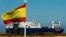 Saudi cargo ship Bahri-Yanbu passes a Spanish flag while departing the port of Santander, Spain, May 13, 2019.