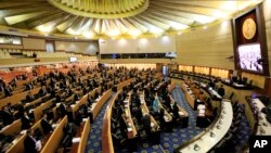 Thailand's legislature, known as the National Reform Council, stands after they voted 135 against 105 in favor with seven abstentions on the new draft constitution, in Bangkok, Sept. 6, 2015.