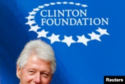 FILE - Former U.S. President Bill Clinton attends a news conference after visiting social projects supported by his foundation in Lima, June 8, 2010.