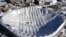 The collapsed roof of the Metrodome is shown in this aerial view in Minneapolis on Sunday, Dec. 12, 2010. The inflatable roof of the Metrodome collapsed Sunday after a snowstorm that dumped 17 inches on Minneapolis. No one was hurt, but the roof failure s