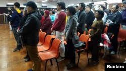 About 200 Catholics attend a prayer meeting for the Chinese Church after news emerge that Beijing and the Vatican have reached a deal on bishop appointments, in Hong Kong, China, Feb. 12, 2018. 