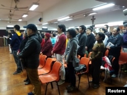 About 200 Catholics attend a prayer meeting for the Chinese Church after news emerge that Beijing and the Vatican have reached a deal on bishop appointments, in Hong Kong, China, Feb. 12, 2018.