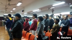 About 200 Catholics attend a prayer meeting for the Chinese Church after news emerge that Beijing and the Vatican have reached a deal on bishop appointments, in Hong Kong, China, Feb. 12, 2018. 