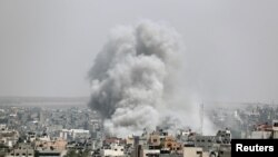 Smoke rises following an Israeli air strike in Gaza, May 5, 2019. 
