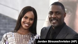 FILE - Idris Elba his wife Sabrina Dhowre Elba are seen here in a July 13, 2019 file photo. Elba says he and his wife had their lives “turned around” after contracting the coronavirus. (Photo by Jordan Strauss/Invision/AP, File)