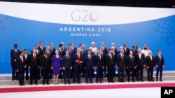 FILE - World leaders participate in a family photo at the G-20 summit, Nov. 30, 2018 in Buenos Aires, Argentina.