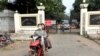 FILE - Prison staff members ride a motorcycle outside Insein Prison in Yangon, Myanmar, Jan. 3, 2019. 