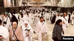 Muslim pilgrims walk in the Al-Safa direction (Safa and Marwah) where Muslims walk back and forth seven times during Tawaf al-Ifada as part of the annual haj pilgrimage rite at the grand Mosque in the holy city of Mecca , Saudi Arabia, Aug. 21, 2018.