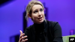 FILE - Elizabeth Holmes, speaks at the Fortune Global Forum in San Francisco, Nov. 2, 2015. Holmes later admitted making mistakes at Theranos, but denied committing crimes.