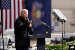 FILE - Democratic presidential candidate former Vice President Joe Biden speaks at a 'Souls to the Polls' drive-in rally at Sharon Baptist Church, Nov. 1, 2020, in Philadelphia.