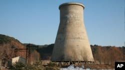 FILE - The file photo, taken Dec. 18, 2007, and released June 27, 2008, by the official Chinese news agency Xinhua, shows the cooling tower at the Yongbyon nuclear complex near Pyongyang, North Korea. 