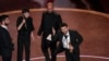 Basel Adra, from left, Rachel Szor, Hamdan Ballal, and Yuval Abraham accept the award for best documentary feature film for "No Other Land" during the Oscars on Sunday, March 2, 2025, at the Dolby Theatre in Los Angeles.