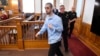 Hadi Matar, charged with severely injuring author Salman Rushdie in a 2022 knife attack, is led into Chautauqua County court in Mayville, New York, Feb. 10, 2025.