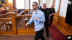 Hadi Matar, charged with severely injuring author Salman Rushdie in a 2022 knife attack, is led into Chautauqua County court in Mayville, New York, Feb. 10, 2025.