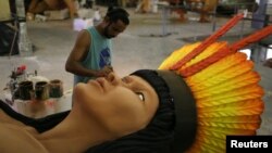 A worker from the Imperatriz Leopoldinense samba school prepares part of a carnival float at the school's carnival production headquarters in Rio de Janeiro, Brazil, Feb. 9, 2017.