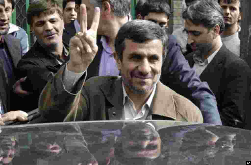 Iranian President Mahmoud Ahmadinejad flashes a victory sign after casting his ballot for the parliamentary elections at a polling station in downtown Tehran, Iran, Friday, March 2, 2012. The balloting for the 290-member parliament is the first major voti