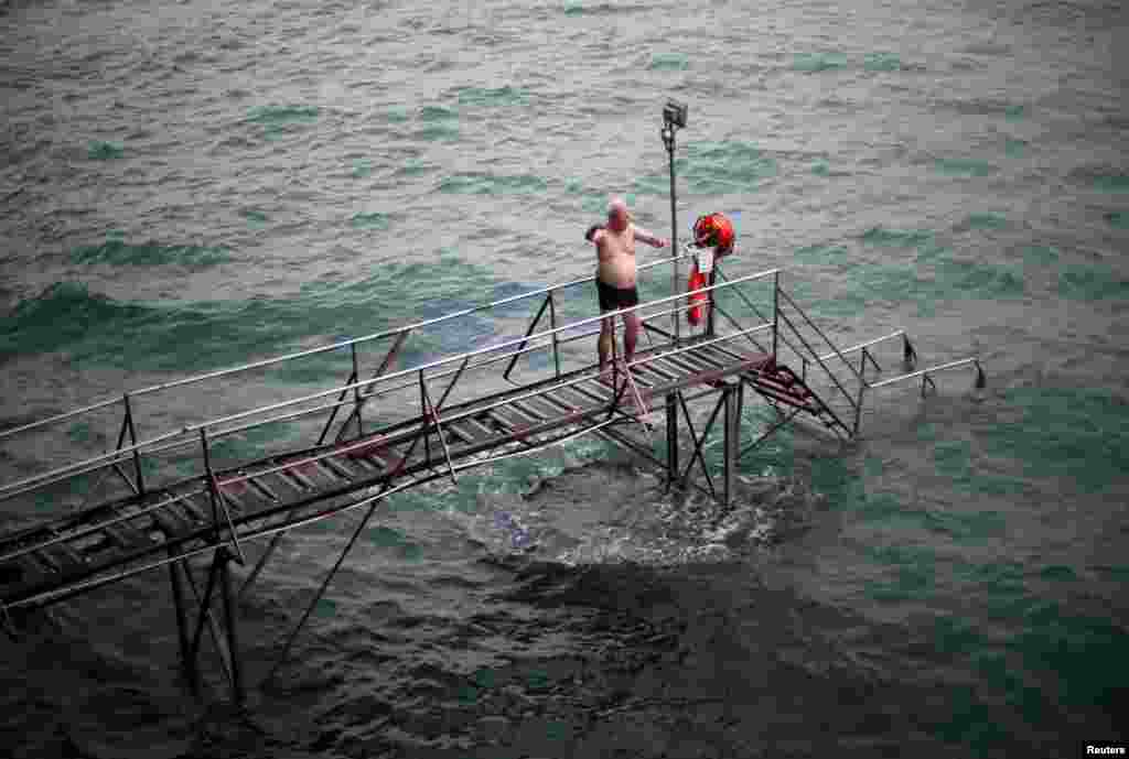 A man prepares to swim at the Sai Wan Swimming Shed in Hong Kong, China, October 7, 2018. REUTERS/Hannah McKay 